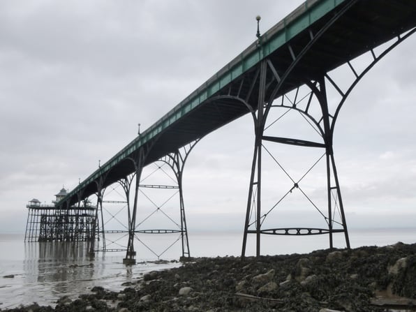The iconic Victorian structure of Clevedon Pier considered as the prime example of the complex maritime restoration realised by Civil and Structural Engineers to help the conservation of maritime heritage