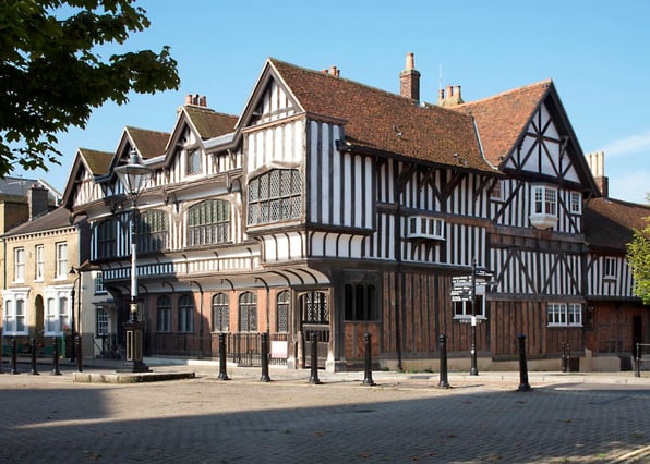 A medieval timber-framed Tudor-style building preserved through the help of historic building specialist structural engineers.